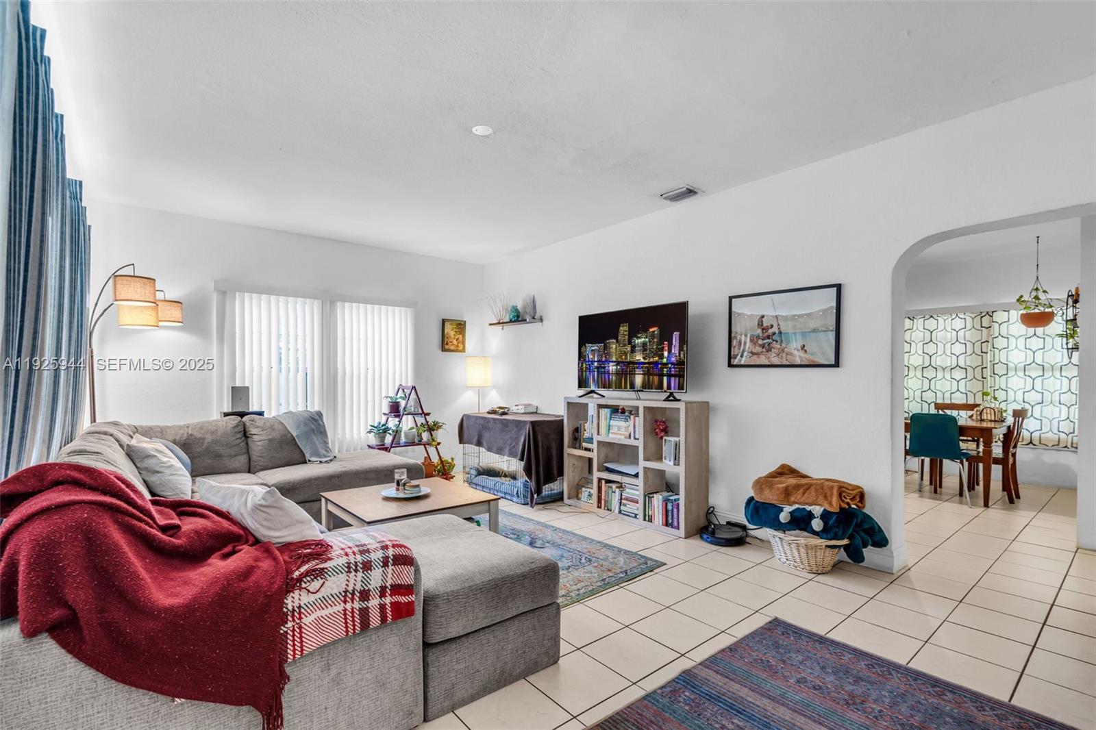 2271 Southwest 11th Street Miami, FL 33135 - Photo 4 of 17 a living room with furniture and a large window