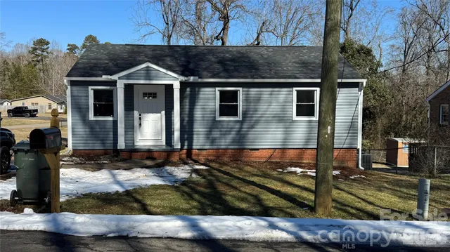 a front view of house with a yard