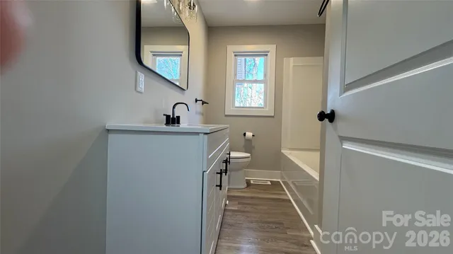 a hallway with a washer and dryer