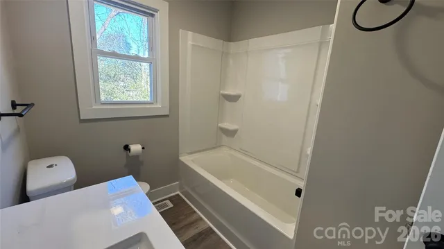 a bathroom with a bath tub and a shower