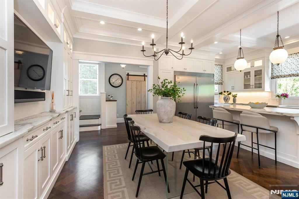 380 Ridgewood Avenue Glen Ridge, NJ 07028 - Photo 25 of 50 a view of a dining room with furniture wooden floor and chandelier