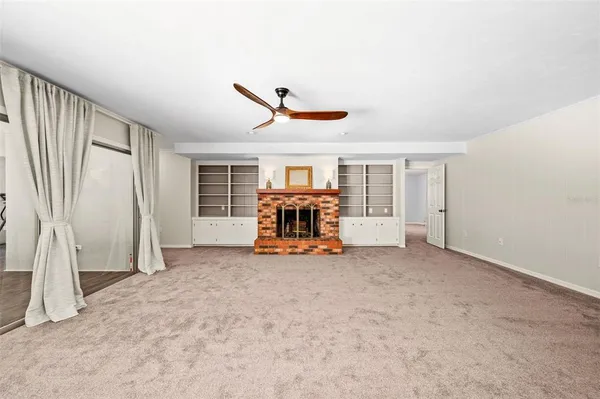 a spacious bedroom with a large bed and a dresser