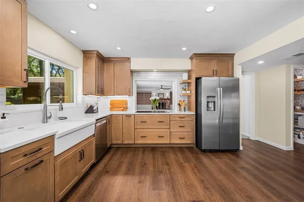 a bathroom with a sink a mirror and a shower
