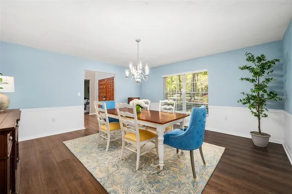 an empty room with furniture and a large window