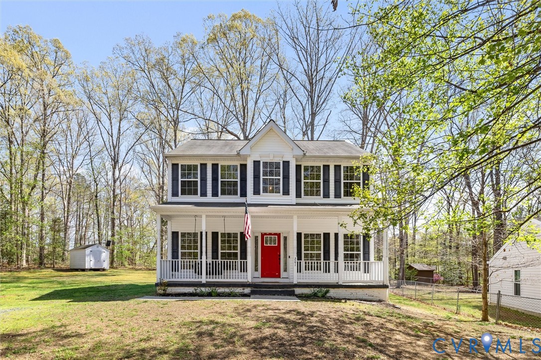 201 Washington Drive Ruther Glen, VA 22546 - Photo 1 of 27 a front view of a house with a yard