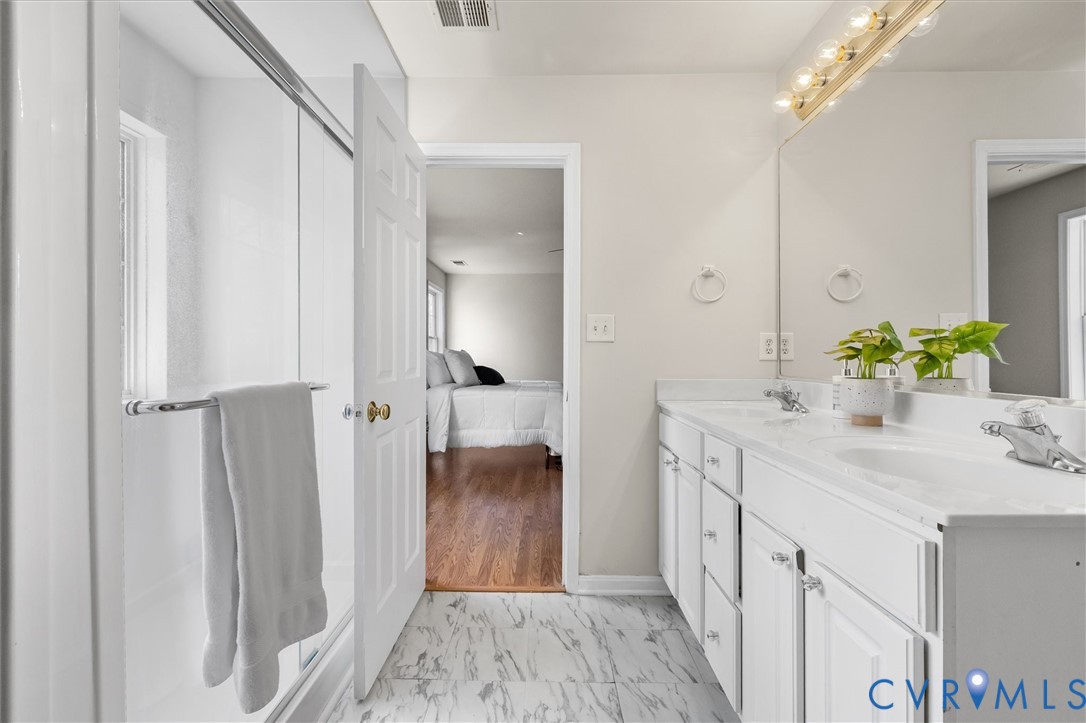 201 Washington Drive Ruther Glen, VA 22546 - Photo 18 of 27 a bathroom with a sink and a mirror
