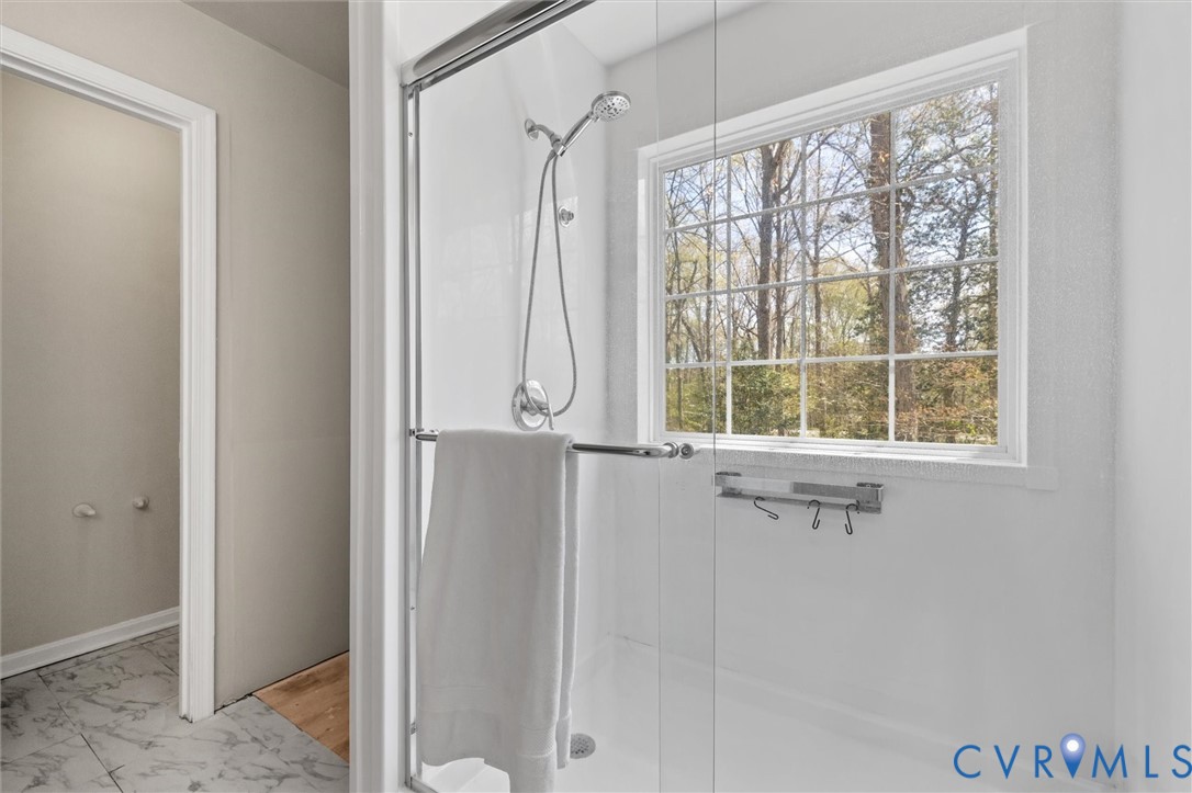201 Washington Drive Ruther Glen, VA 22546 - Photo 19 of 27 a bathroom with a window and a shower