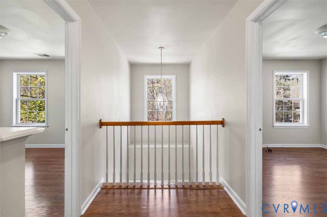 201 Washington Drive Ruther Glen, VA 22546 - Photo 20 of 27 a view of hallway with wooden floor and a chandelier