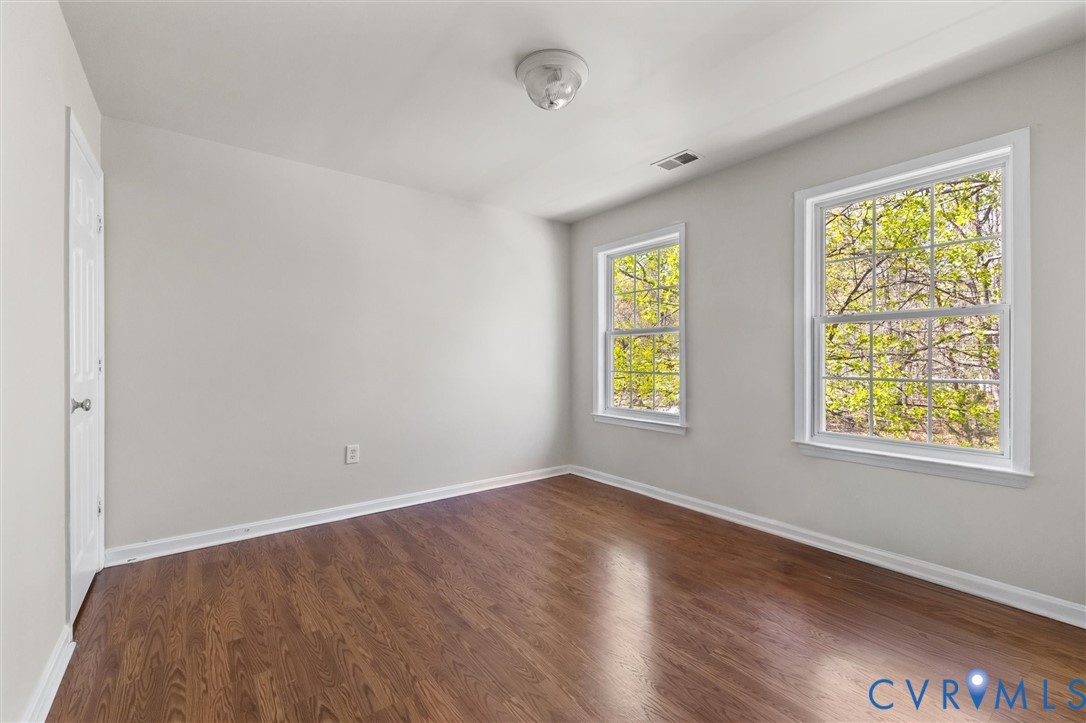 201 Washington Drive Ruther Glen, VA 22546 - Photo 23 of 27 a view of an empty room with wooden floor and a window
