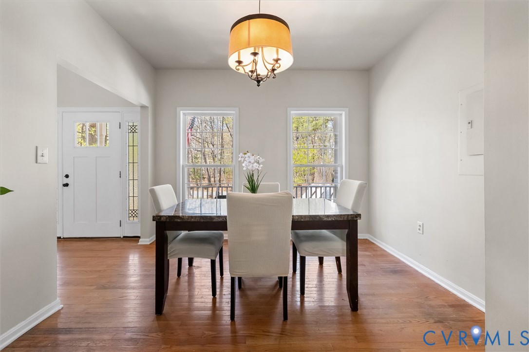 201 Washington Drive Ruther Glen, VA 22546 - Photo 6 of 27 a view of a dining room with furniture a chandelier and wooden floor