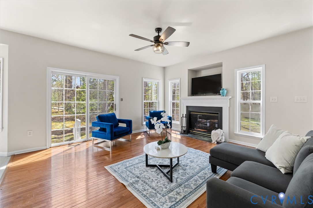 201 Washington Drive Ruther Glen, VA 22546 - Photo 8 of 27 a living room with furniture a fireplace and a flat screen tv