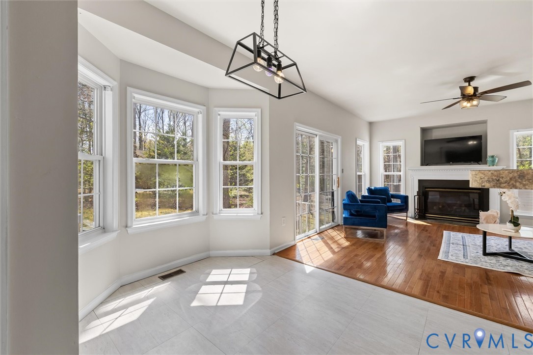 201 Washington Drive Ruther Glen, VA 22546 - Photo 10 of 27 a living room with furniture windows and a fireplace