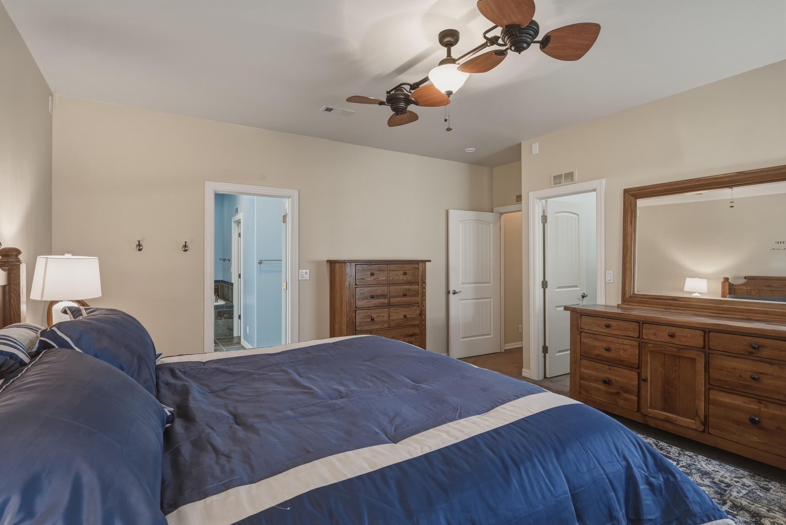 1233 Merzville Road Forest Lakes, AZ 85931 - Photo 17 of 39 a spacious bedroom with a bed and a dresser