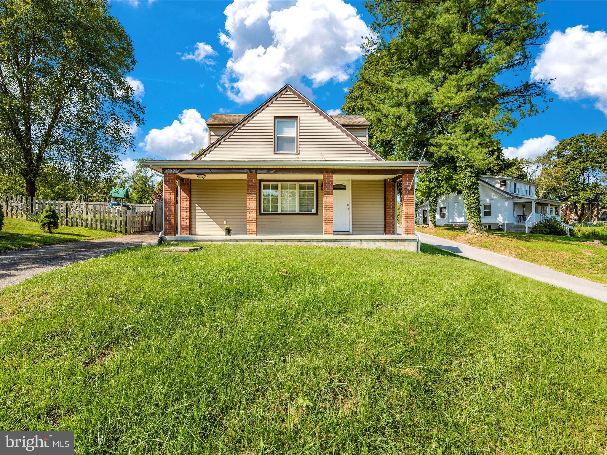 15221 Clear Spring Road Williamsport, MD 21795 - Photo 54 of 62 a front view of a house with a yard