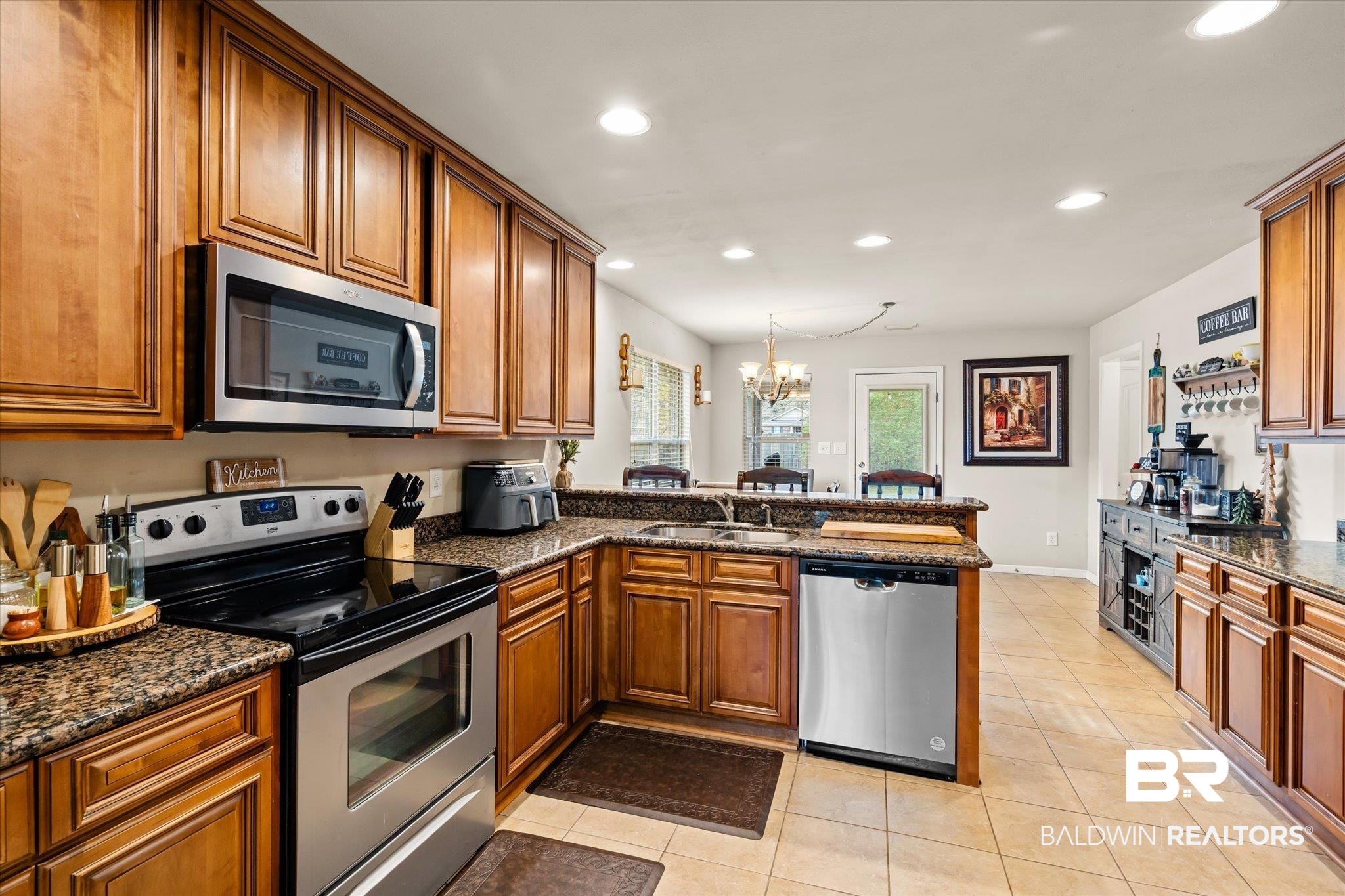 2855 Rebecca Drive West Mobile, AL 36618 - Photo 5 of 22 Kitchen featuring an inviting chandelier, sink, light tile patterned floors, appliances with stainless steel finishes, and kitchen peninsula
