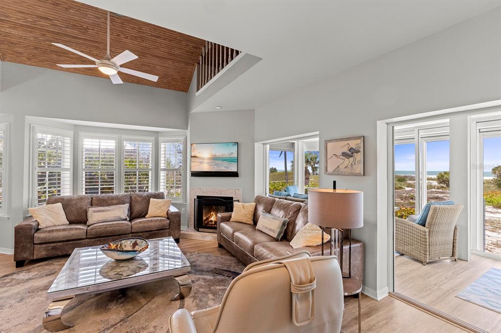 17 Seawatch Drive Boca Grande, FL 33921 - Photo 11 of 47 a living room with furniture fireplace and a large window