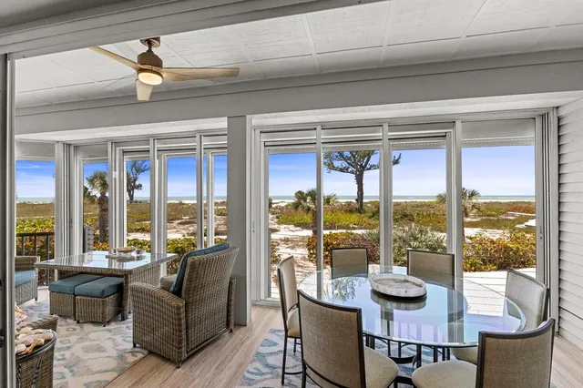 a large kitchen with a lot of counter space and wooden floor