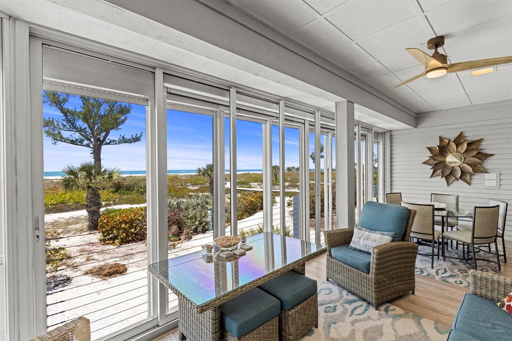 17 Seawatch Drive Boca Grande, FL 33921 - Photo 13 of 47 a living room with furniture and a large window with garden view