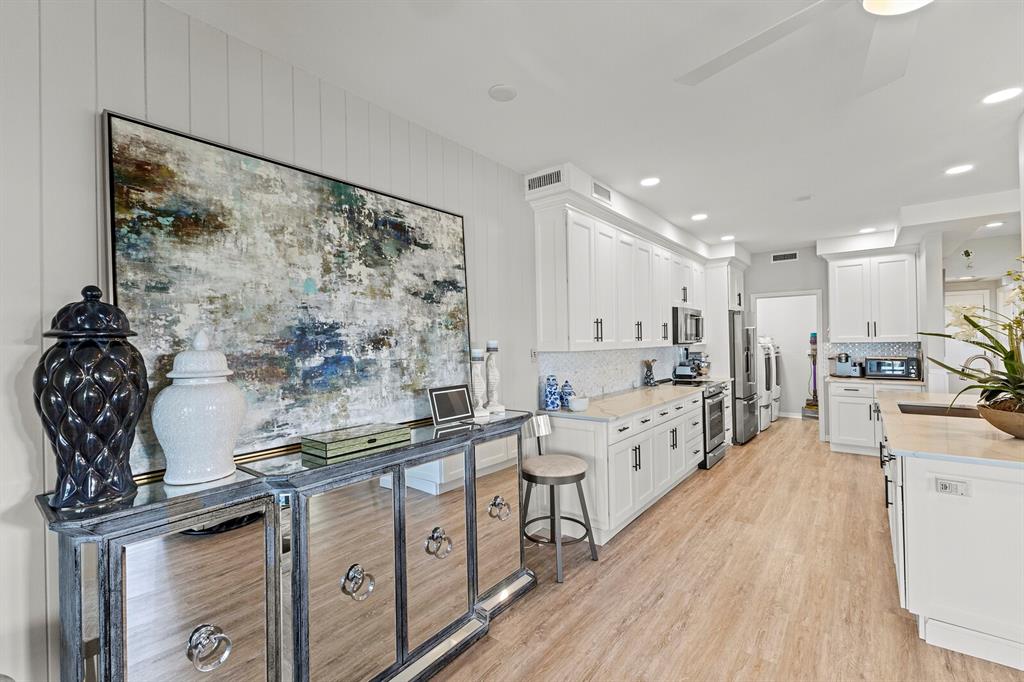 17 Seawatch Drive Boca Grande, FL 33921 - Photo 14 of 47 a large kitchen with a lot of counter space and wooden floor