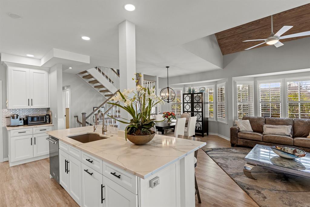 17 Seawatch Drive Boca Grande, FL 33921 - Photo 15 of 47 a kitchen with sink refrigerator and stove