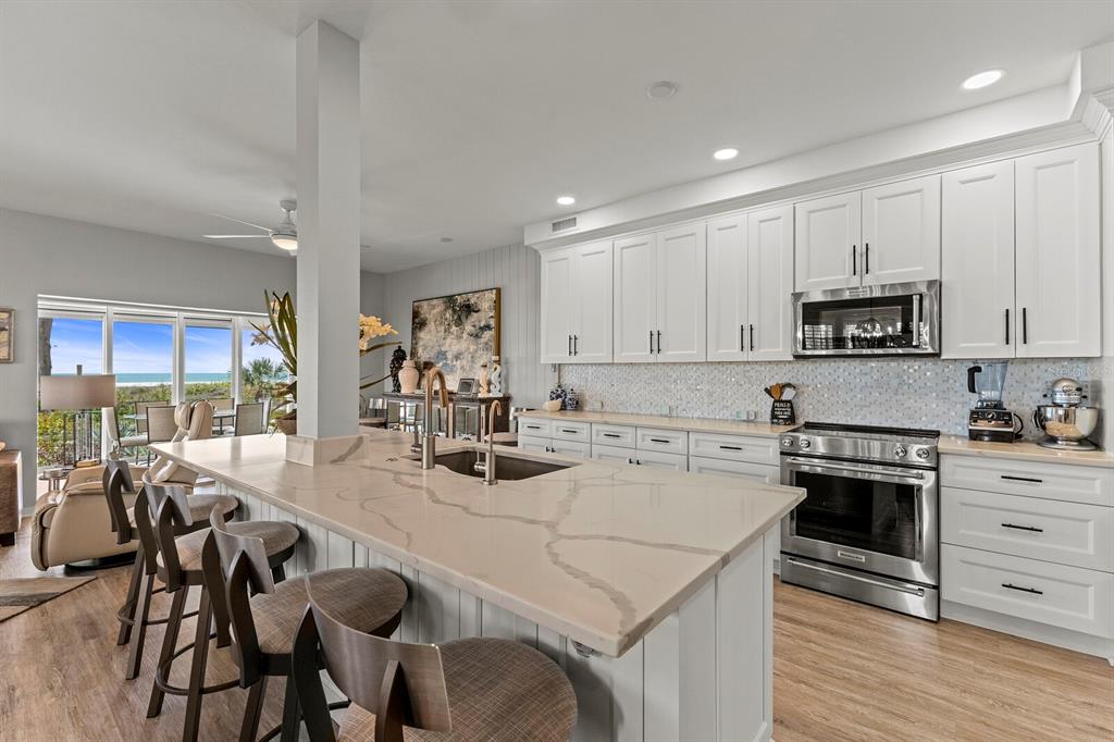 17 Seawatch Drive Boca Grande, FL 33921 - Photo 18 of 47 a kitchen with a stove a sink and a refrigerator