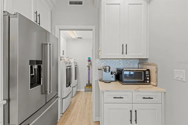 a bed room with two bed and a large window