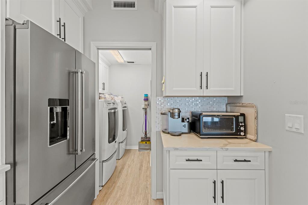 17 Seawatch Drive Boca Grande, FL 33921 - Photo 19 of 47 a kitchen with stainless steel appliances white cabinets and a refrigerator