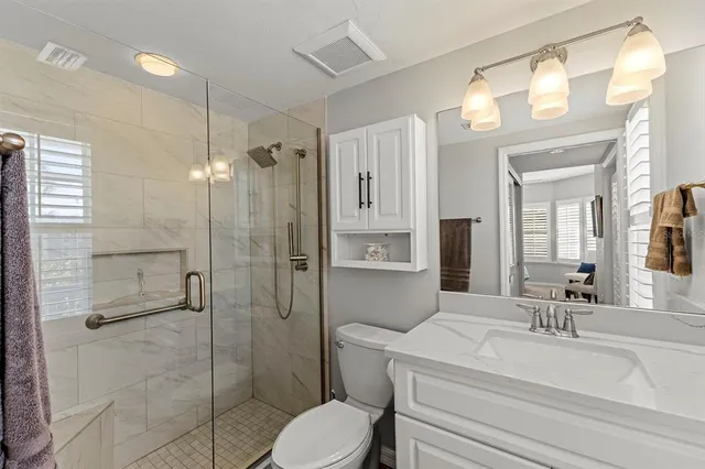 a bedroom with a bed and a table in it