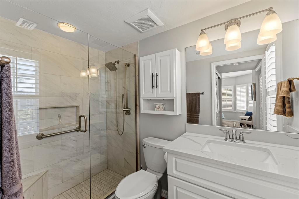 17 Seawatch Drive Boca Grande, FL 33921 - Photo 24 of 47 a bathroom with a sink a toilet and shower