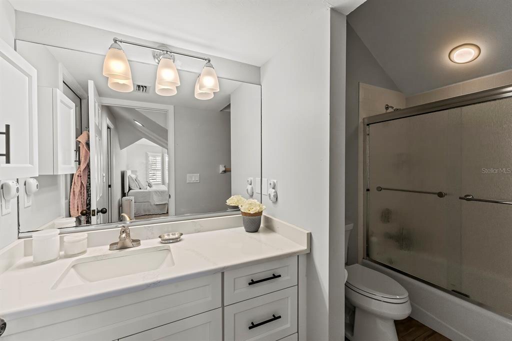 17 Seawatch Drive Boca Grande, FL 33921 - Photo 36 of 47 a bathroom with a sink a toilet a mirror and shower