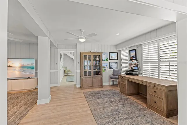 a view of staircase with wooden floor and a rug