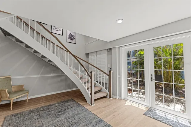 a living room with furniture or couch and a floor to ceiling window