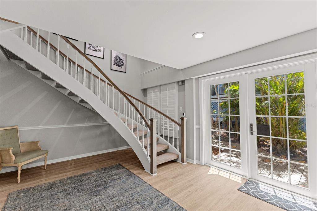 17 Seawatch Drive Boca Grande, FL 33921 - Photo 8 of 47 a view of staircase with wooden floor and a rug