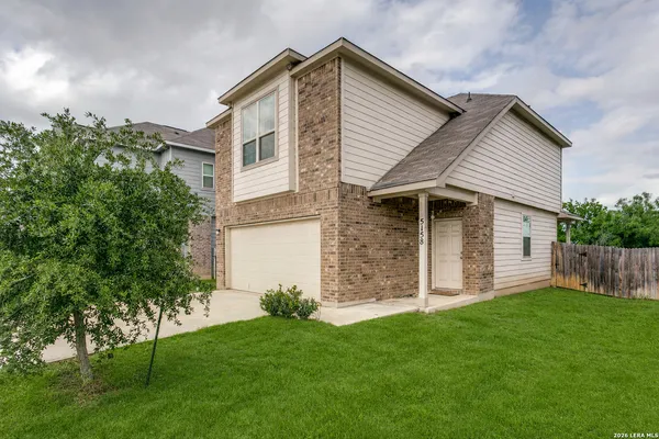 front view of a house with a yard