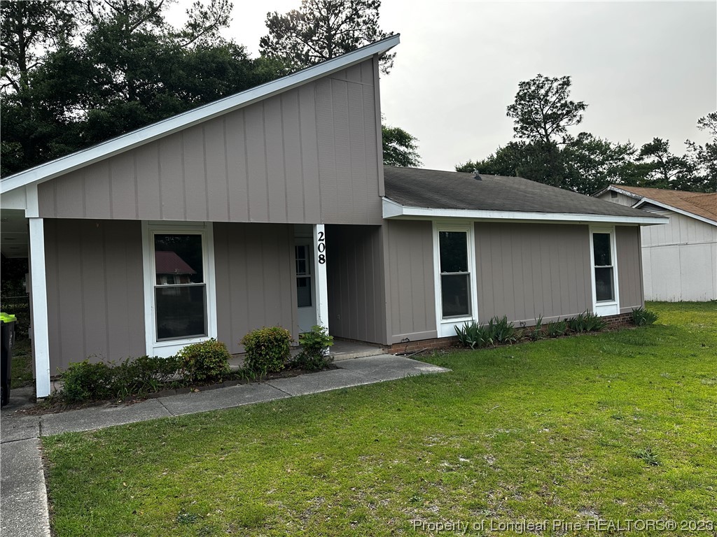 208 Duncan Road Spring Lake, NC 28390 - Photo 1 of 17 a front view of house with yard and green space