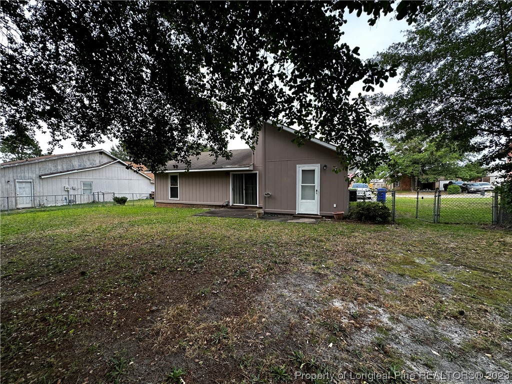 208 Duncan Road Spring Lake, NC 28390 - Photo 15 of 17 a view of a house with yard and a tree