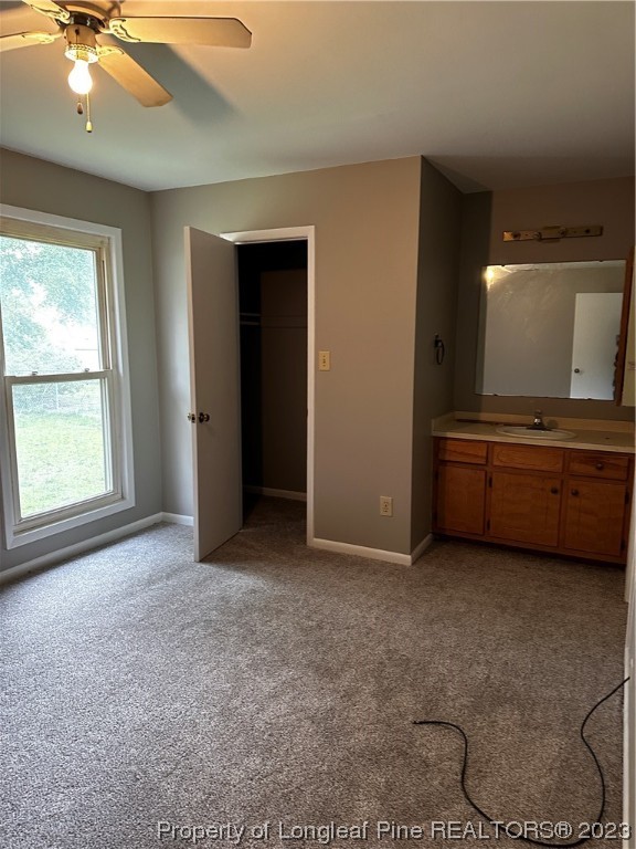 208 Duncan Road Spring Lake, NC 28390 - Photo 4 of 17 a view of an empty room with window and cabinet