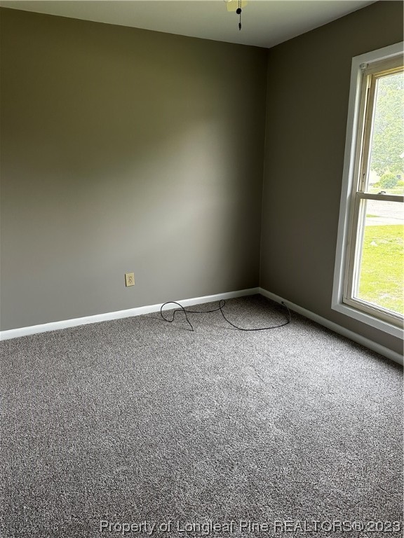 208 Duncan Road Spring Lake, NC 28390 - Photo 8 of 17 an empty room with a window