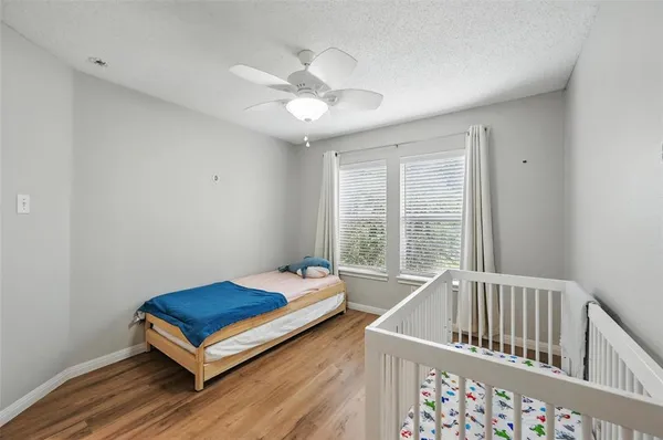a bedroom with furniture and window