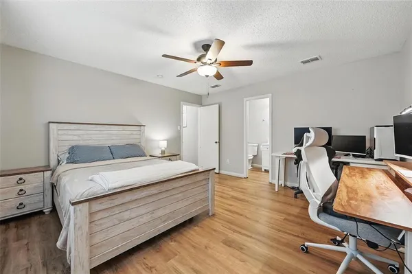 a bedroom with bed and window