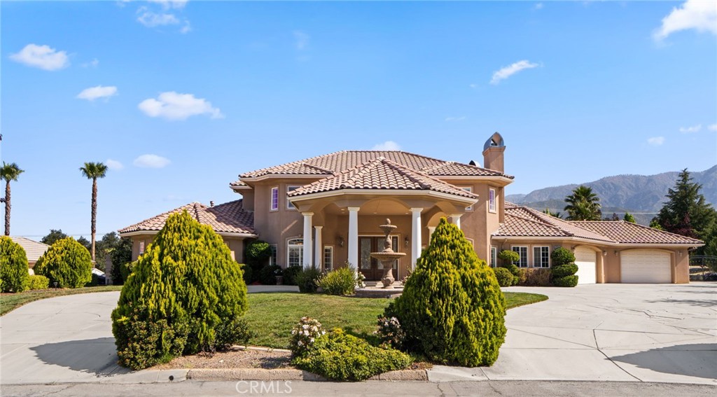 38136 Butterfly Court Yucaipa, CA 92399 - Photo 10 of 71 a front view of a house with garden