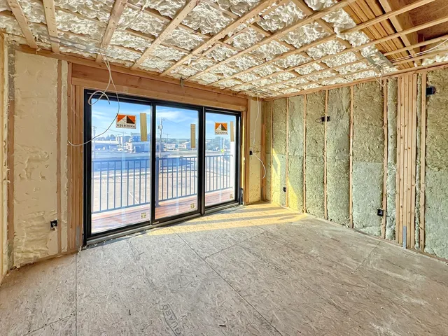 a view of a balcony with wooden floor