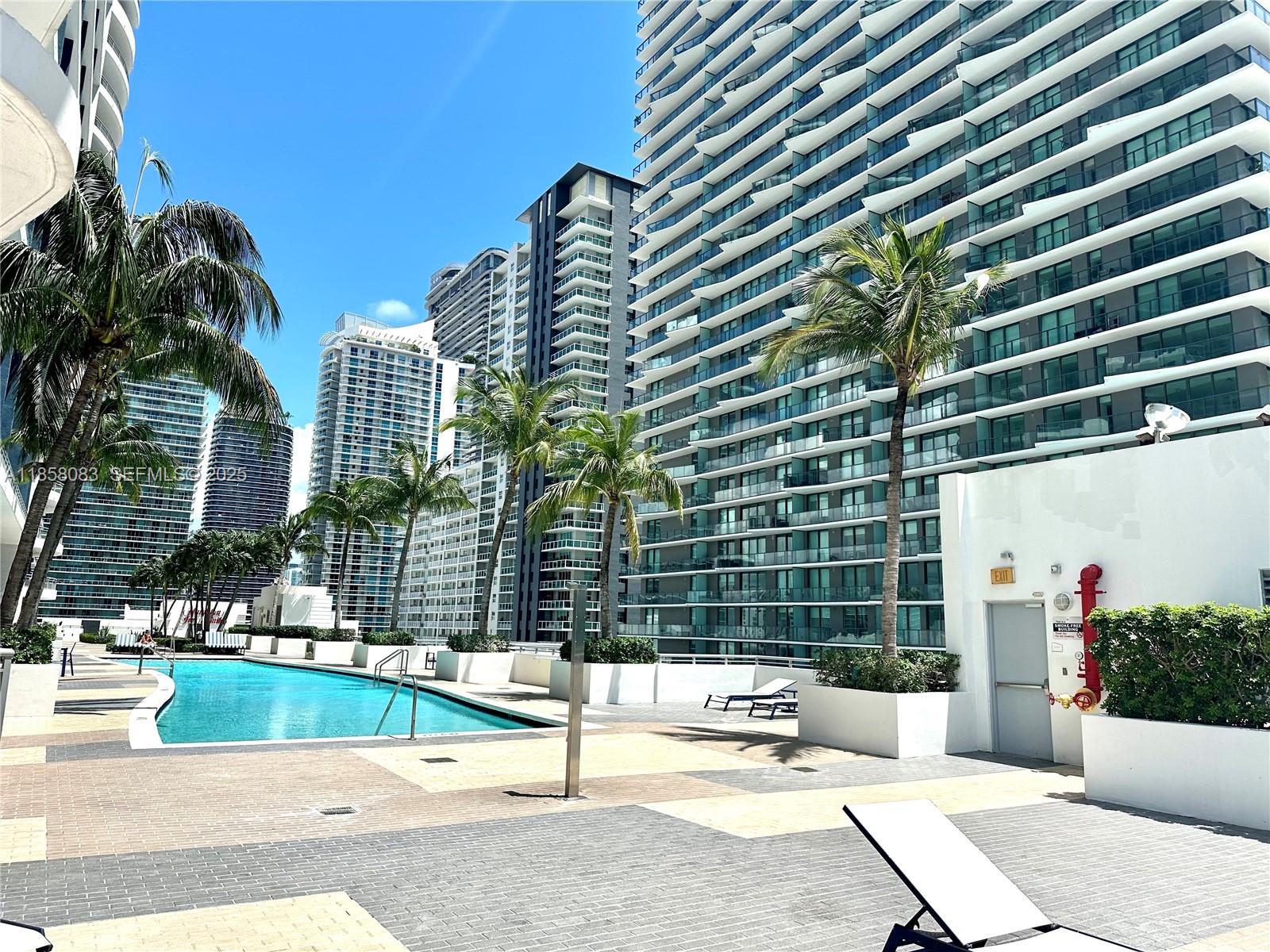 60 Southwest 13th Street, Unit 3207 Miami, FL 33130 - Photo 29 of 30 a view of building with yard and swimming pool