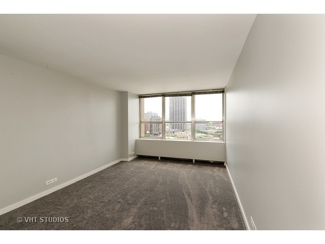 655 West Irving Park Road, Unit 1515 Chicago, IL 60613 - Photo 6 of 10 a view of an empty room with a window