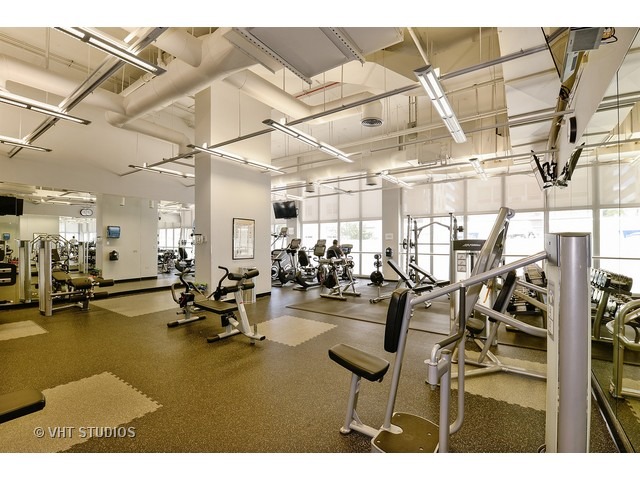 655 West Irving Park Road, Unit 1515 Chicago, IL 60613 - Photo 8 of 10 a view of a room with gym equipment