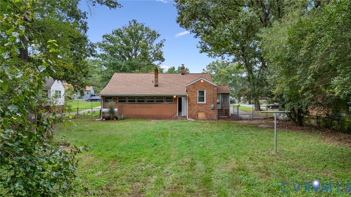 5317 River Road Petersburg, VA 23803 - Photo 18 of 19 Expansive grassy yard with mature trees and a bric