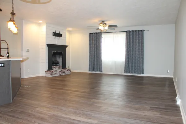 a view of livingroom and hardwood floor