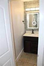 a view of a room with wooden floor and cabinet