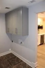 a view of a porch with wooden floor and fence
