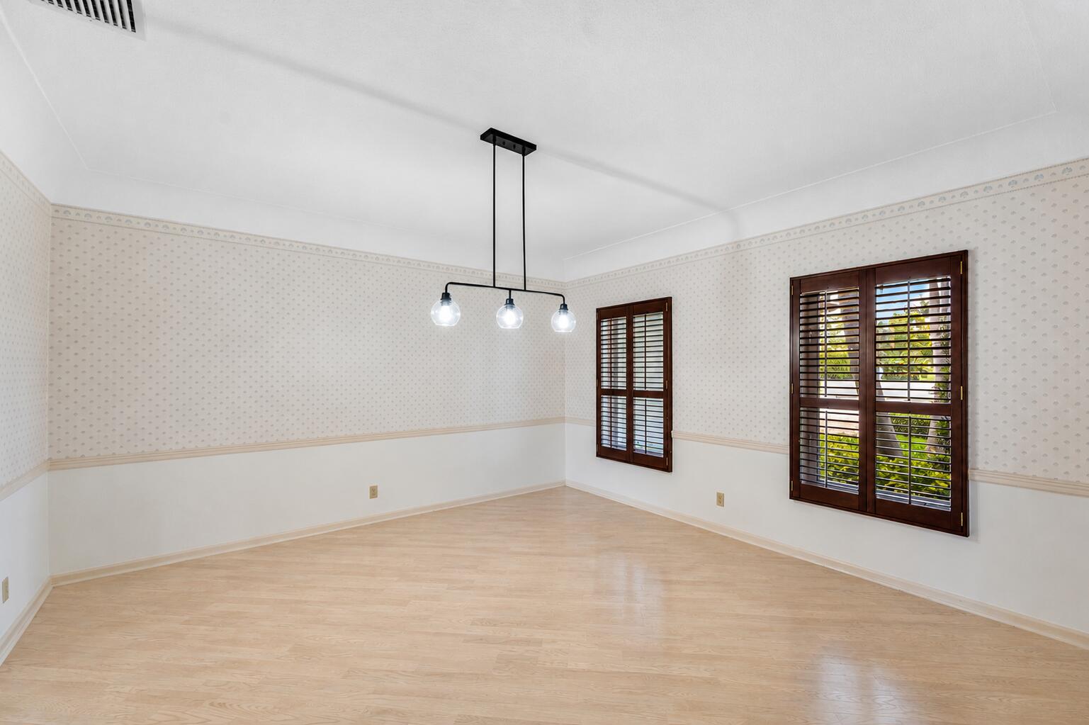 1851 Thatch Palm Drive Boca Raton, FL 33432 - Photo 21 of 70 a view of an empty room with a window